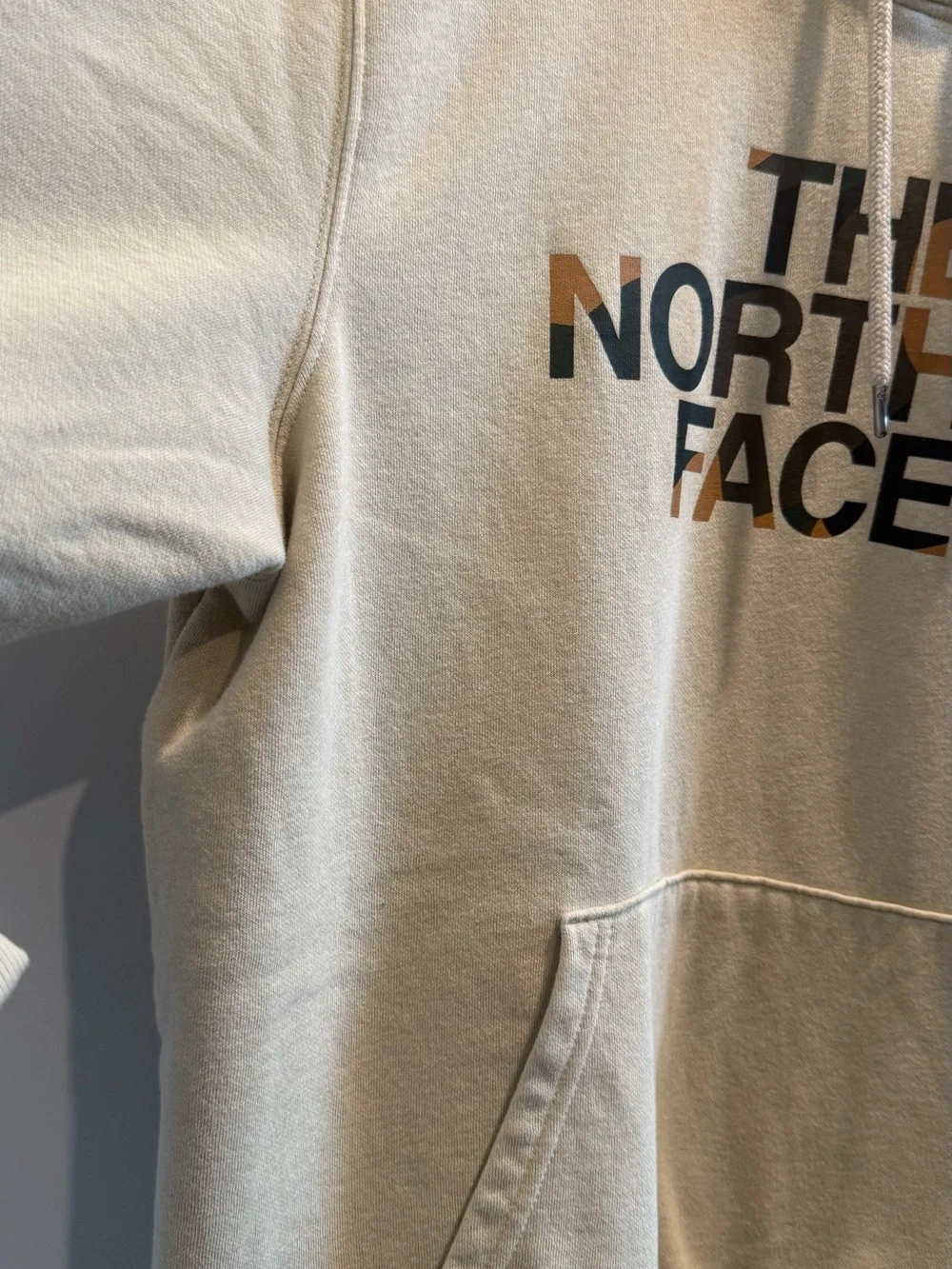 The North Face Men's Cream Logo Pullover Hoodie with Multicolor Logo
